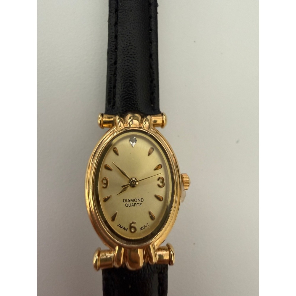 Diamond Quartz Gold Tone Oval Case Watch Black Leather Strap Japan Movt